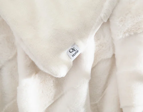 Close up on the folded surface of our Etched Check Throw - Frost.