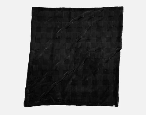 Our Etched Check Throw - Black Ink lying on a white background.