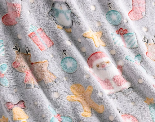 Close-up of the fleece fabric ruffled on our Frosted Fun Glow in the Dark Throw.