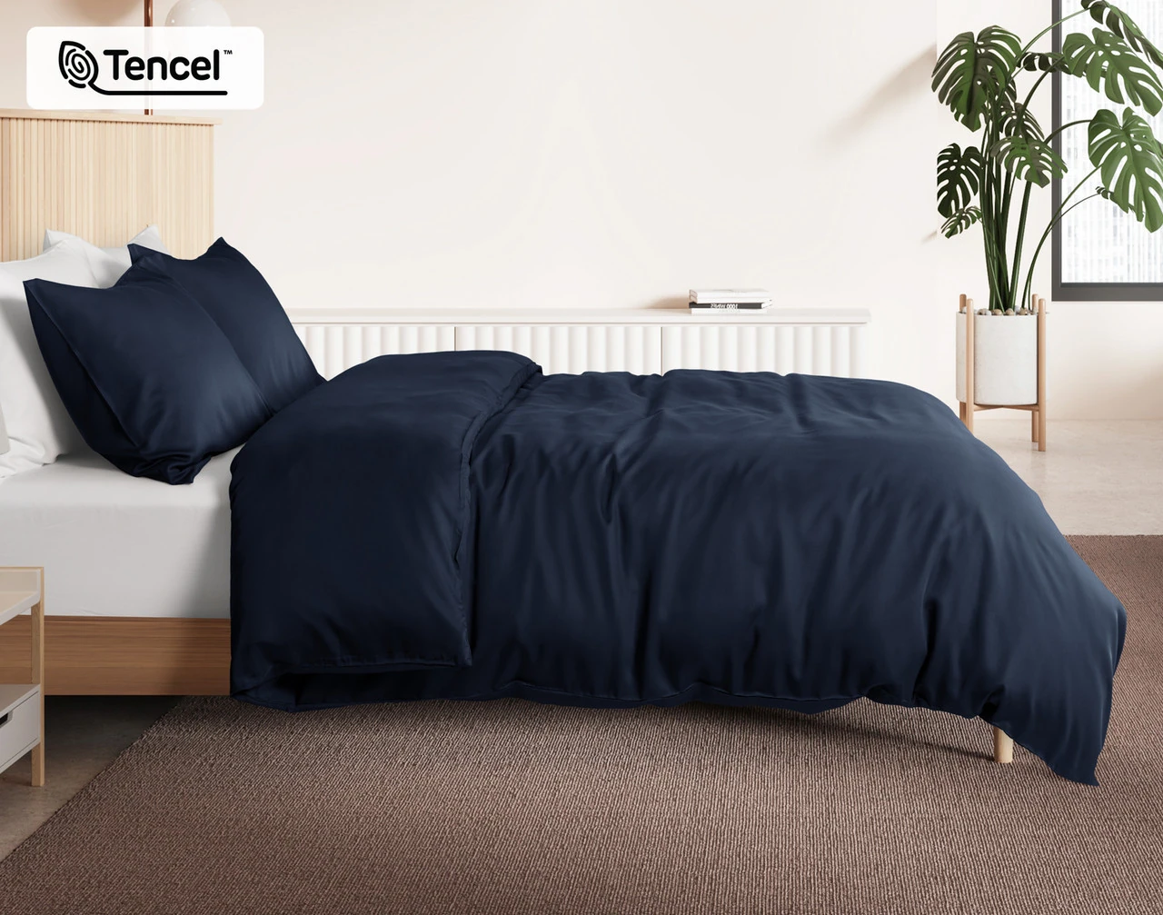 Side view of our Deep Space BeechBliss Duvet Cover dressed over a plain queen bed.