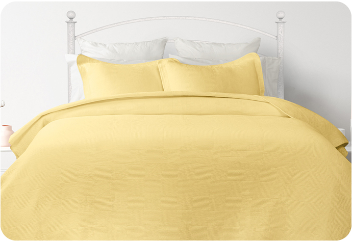 Our Kenzie Cotton Quilt Set in Canary yellow with coordinating yellow pillow shams