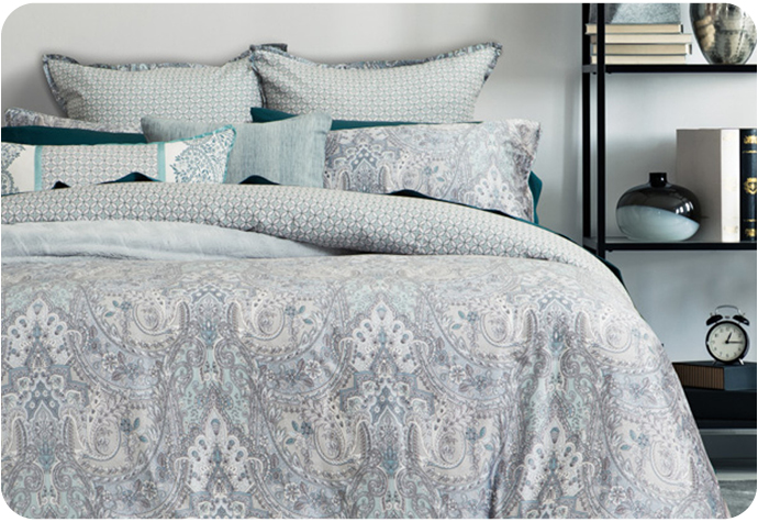 Our Danube Bedding Collection features a patterned blue and white duvet cover and coordinating pillow shams