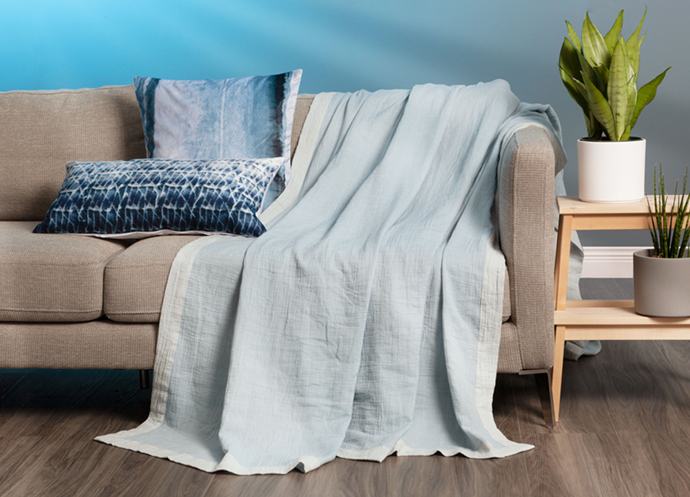 Air Cotton Blanket in Denim on couch