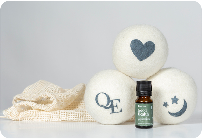 QE Home Linen Love Wool Dryer Ball Set & Laundry Blend Blend with essential oils on a white background