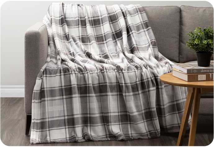 Our Plaid Fleece Throw in Stone featuring grey and white checkered pattern.