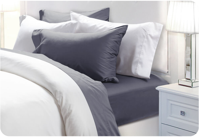 Our 300TC Organic Cotton Sheet Set in Waterway shown on a bed.