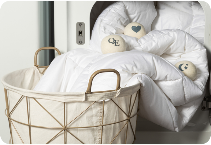 Our Linen Love Wool Dryer Ball Set shown being used with a load of laundry.