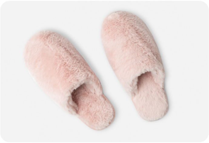 Our Plush Faux Fur Slippers in Blush Pink on a white background.